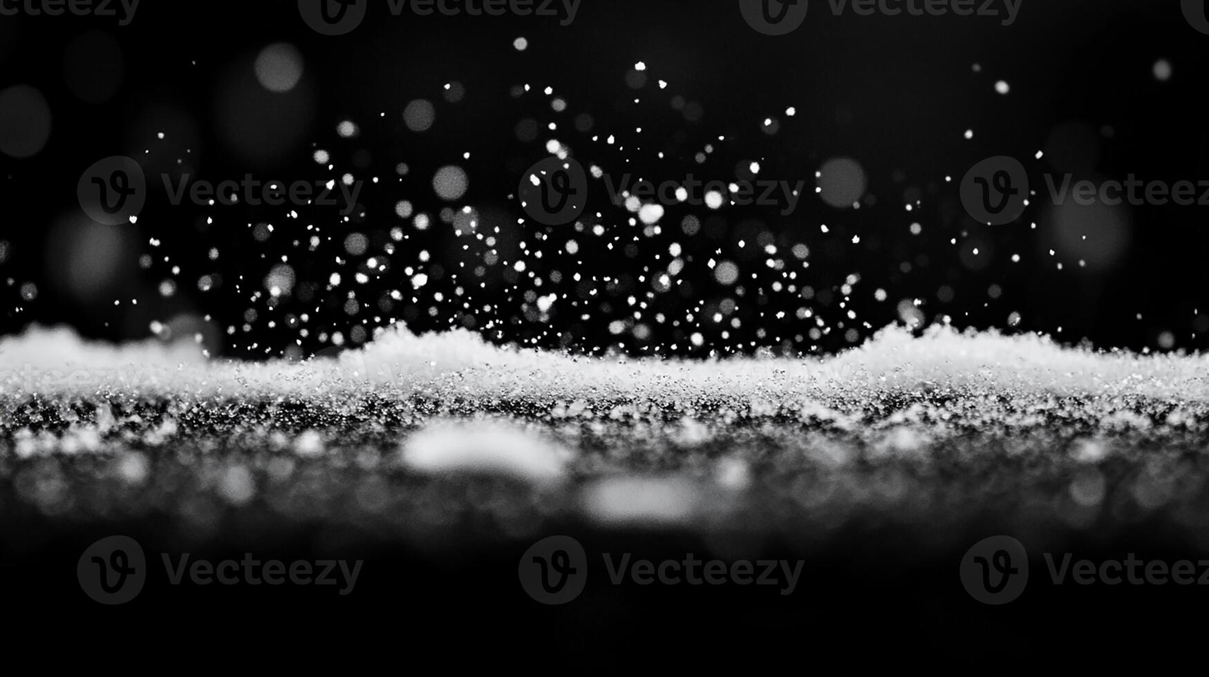 Snowflakes Floating Above a Snowy Ground with Bokeh Lights photo