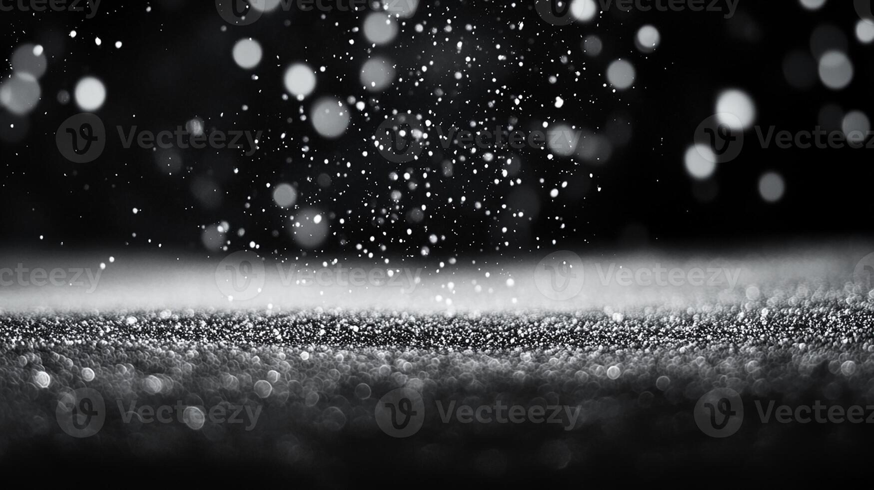 Snowflakes Falling on Black Surface with Bokeh Effect photo