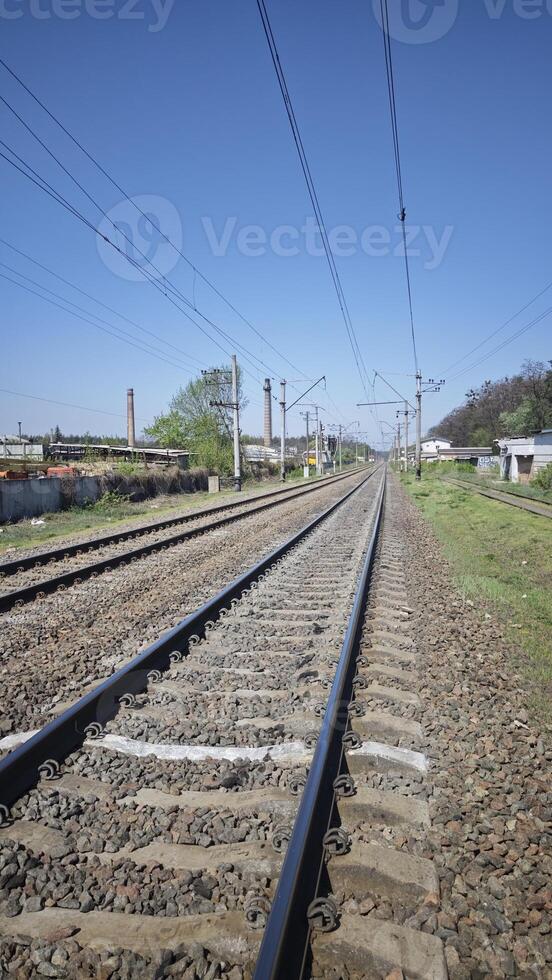 Railway tracks stretching into the distance photo