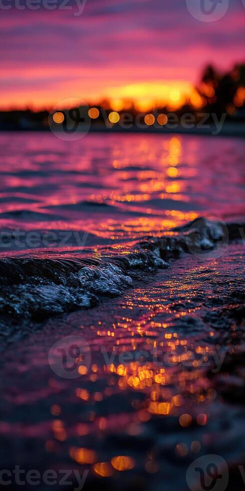 Sunset hues reflecting on calm water surface in evening photo