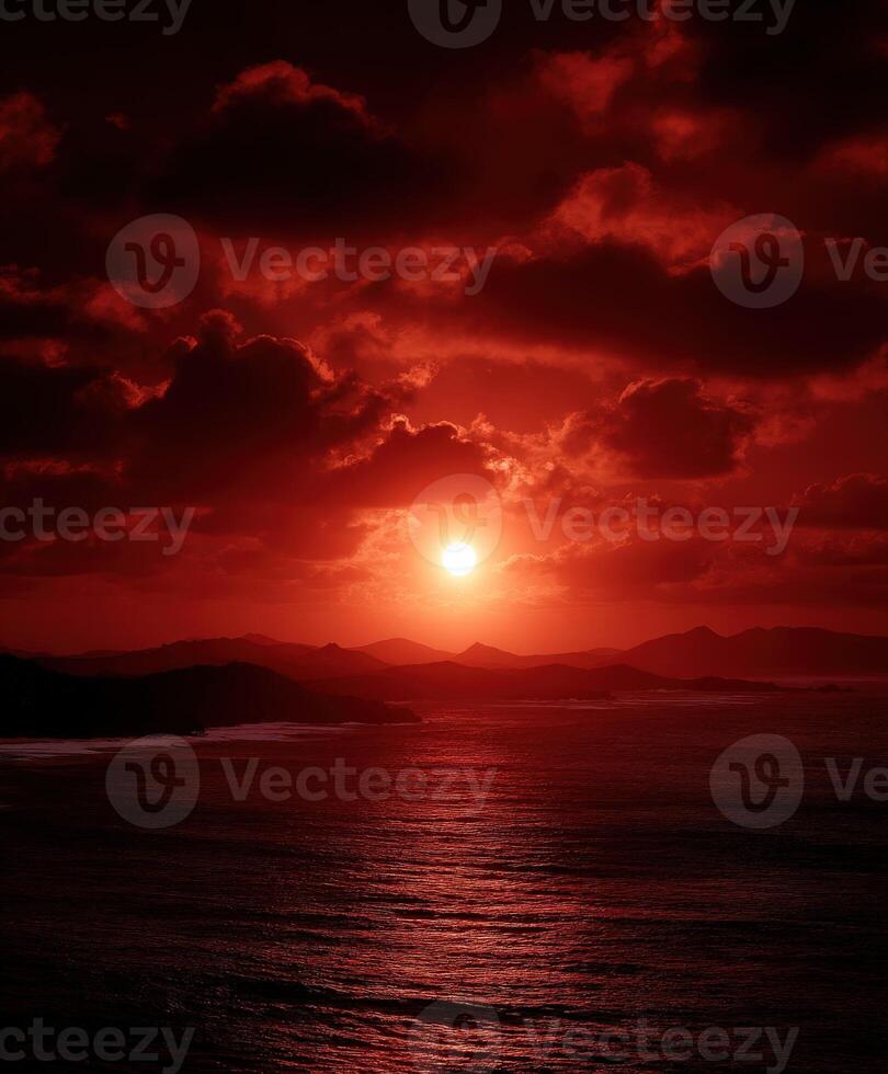Stunning sunset over the ocean with dramatic red hues photo