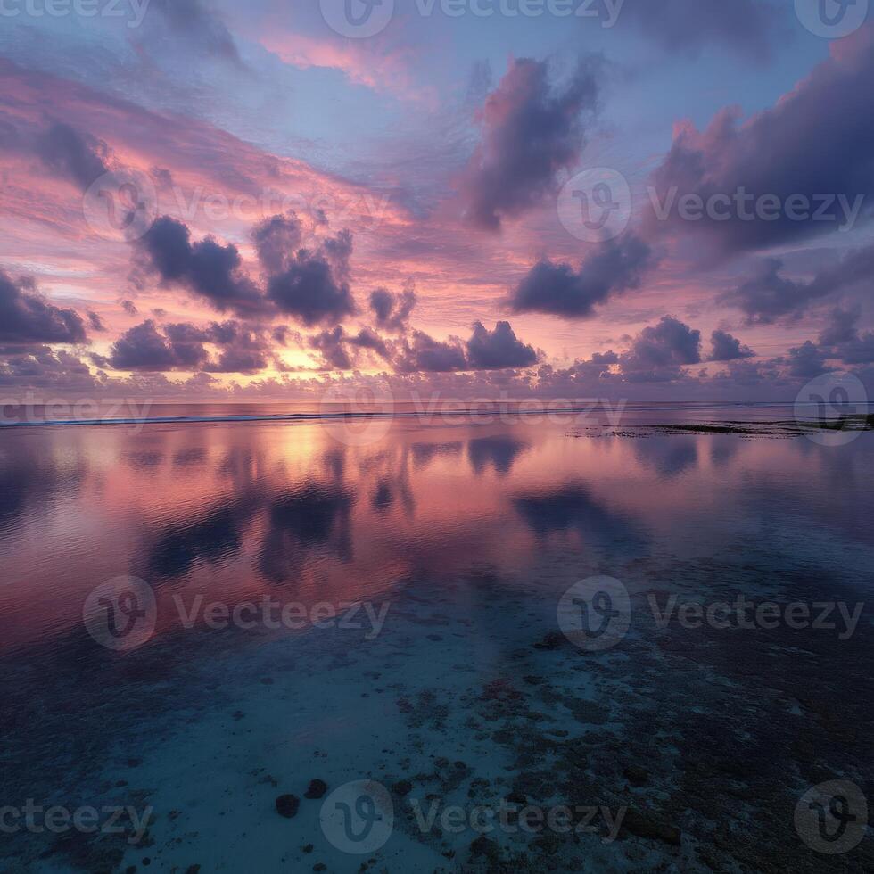 Stunning sunset over calm ocean waters at coastal location photo