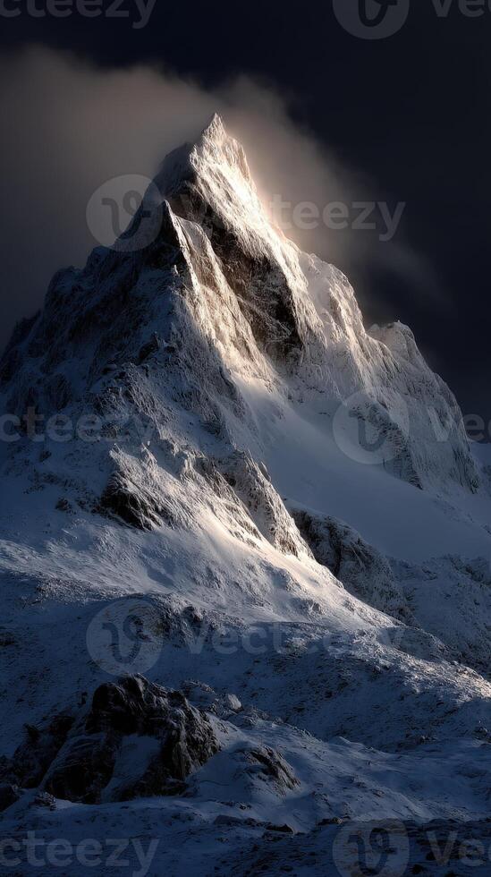 Stunning view of a snow-capped mountain peak at sunrise photo