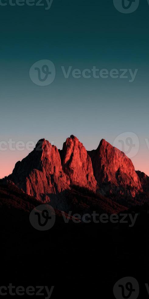 Majestic mountains illuminated by sunset glow in the sky photo