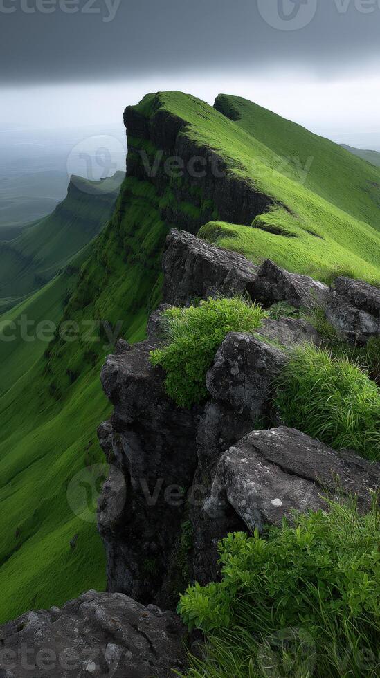 Breathtaking view of green mountain cliffs under a cloudy sky photo