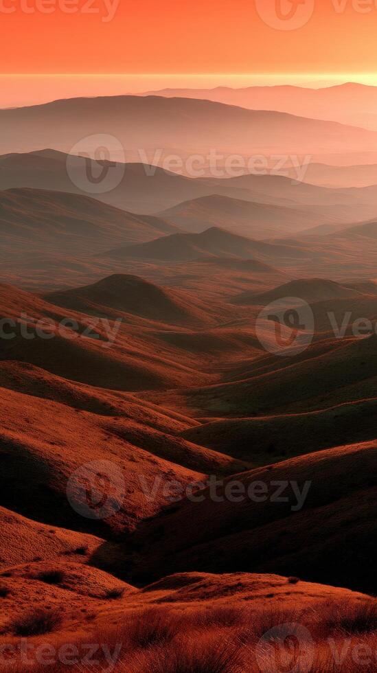 Sunset over rolling hills creating a serene landscape photo