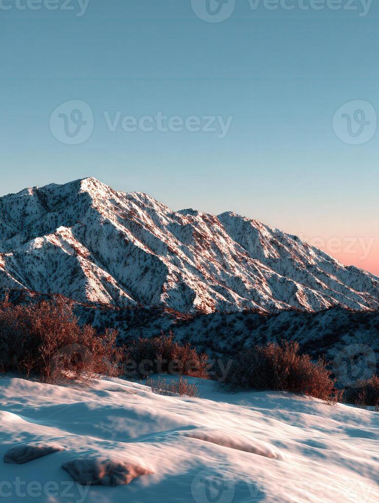 Majestic snow-covered mountains during sunset in winter photo