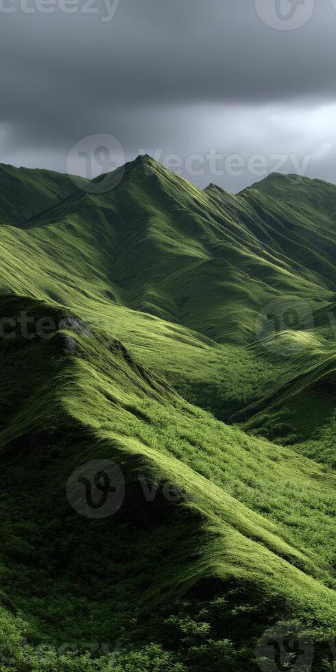 Majestic green hills under cloudy sky in a remote location photo