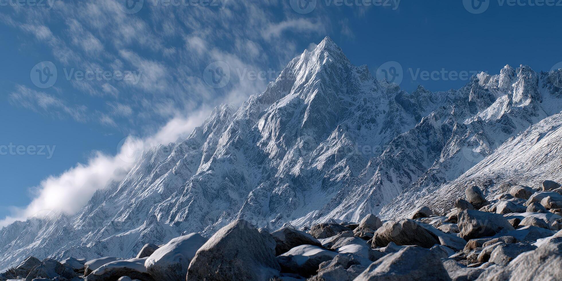 A mountain with rocks and snow on top photo