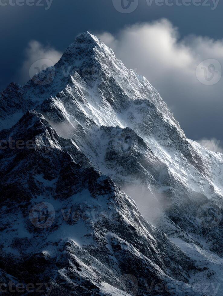 Majestic snow-covered mountain peak under cloudy sky photo