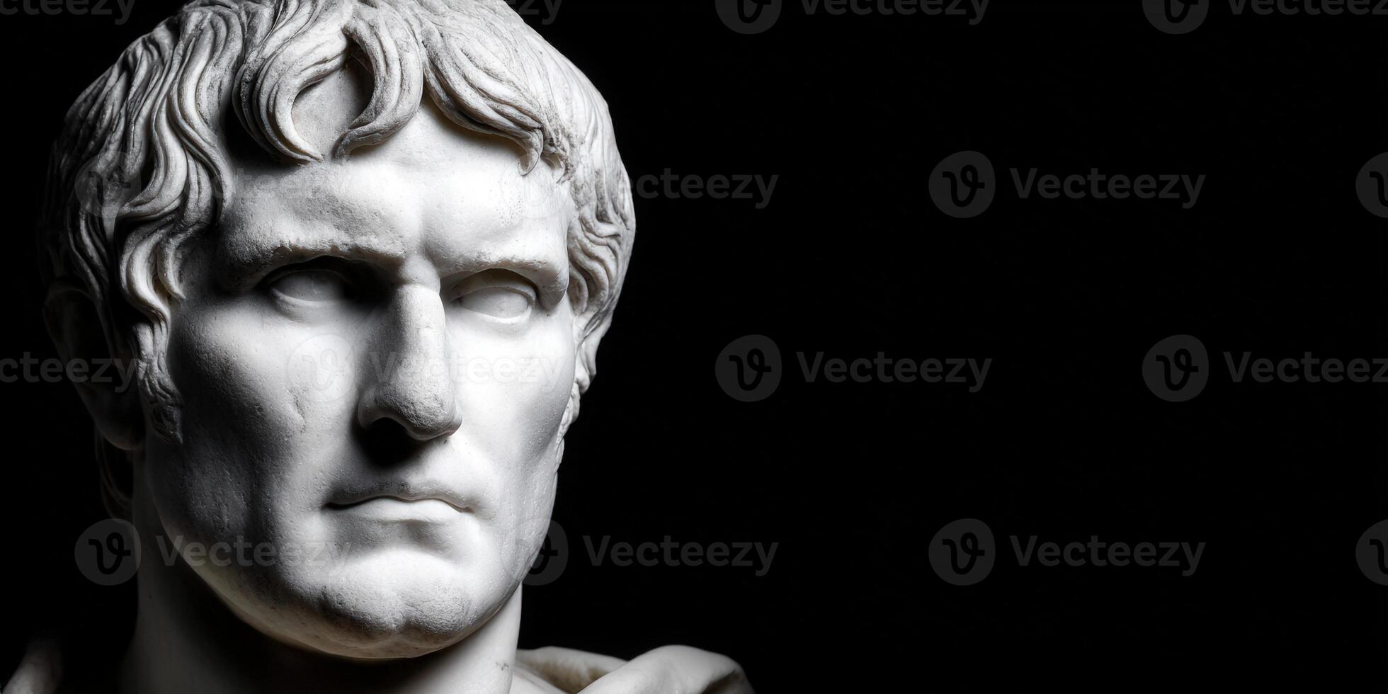 Strong stoic statue representing ancient philosophy in a dark setting photo
