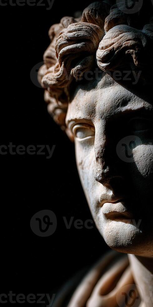 Stoic marble sculpture with expressive features displayed in dim lighting photo