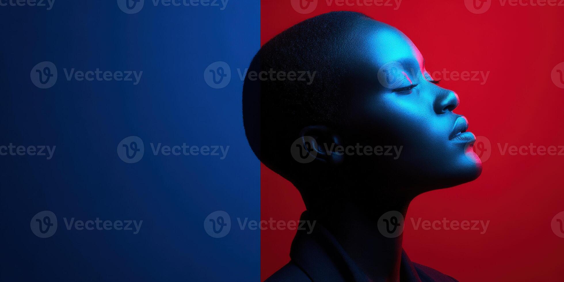 Portrait of a person illuminated by blue and red lighting with a serene expression photo