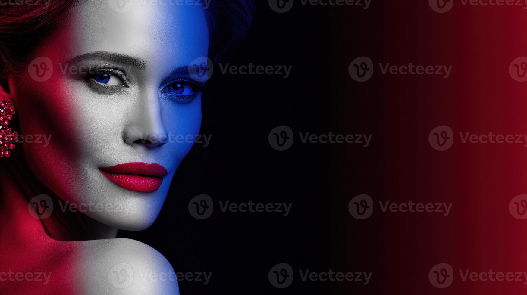 Elegant portrait of a woman with striking makeup and dramatic lighting photo