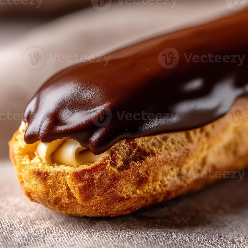 Decadent chocolate eclair with creamy filling on a soft pastry base photo