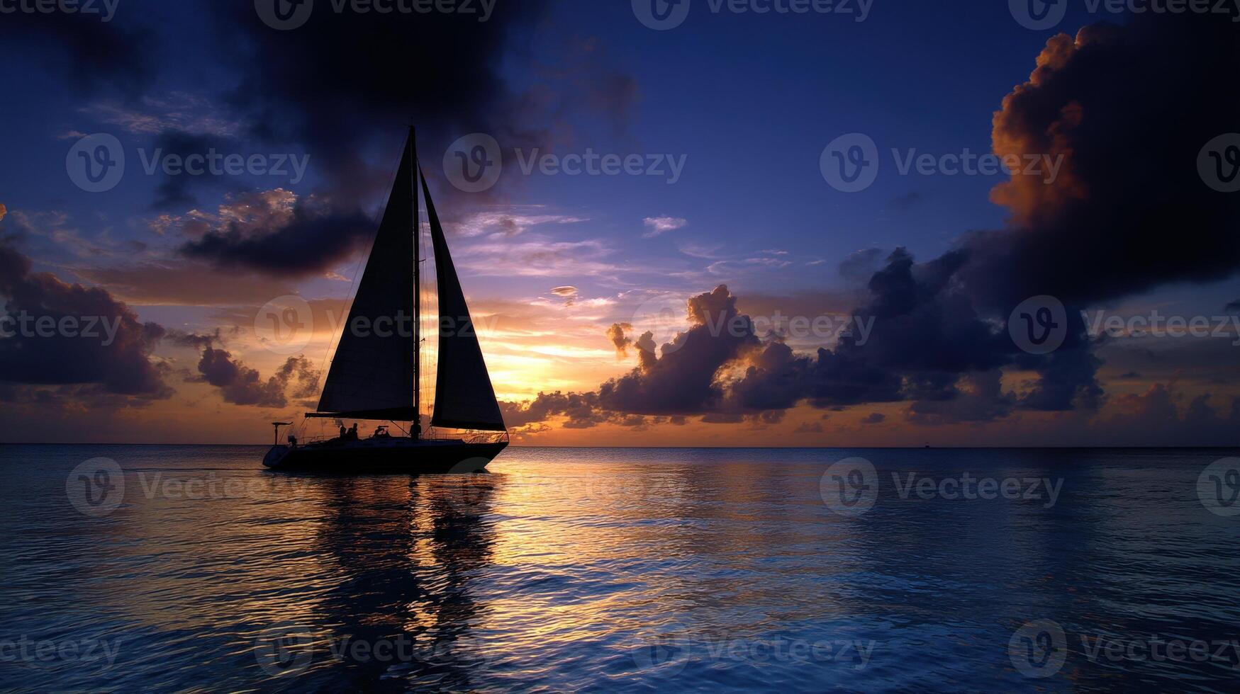 Sailing into the sunset with vibrant clouds reflecting on tranquil water photo