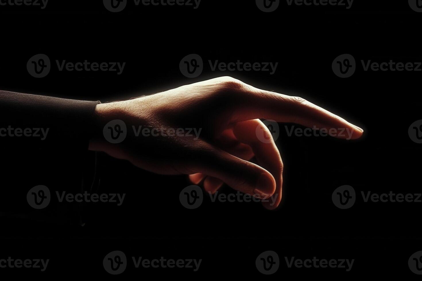 Elegant hand gesture reaching out against a dark background, conveying connection and intention photo