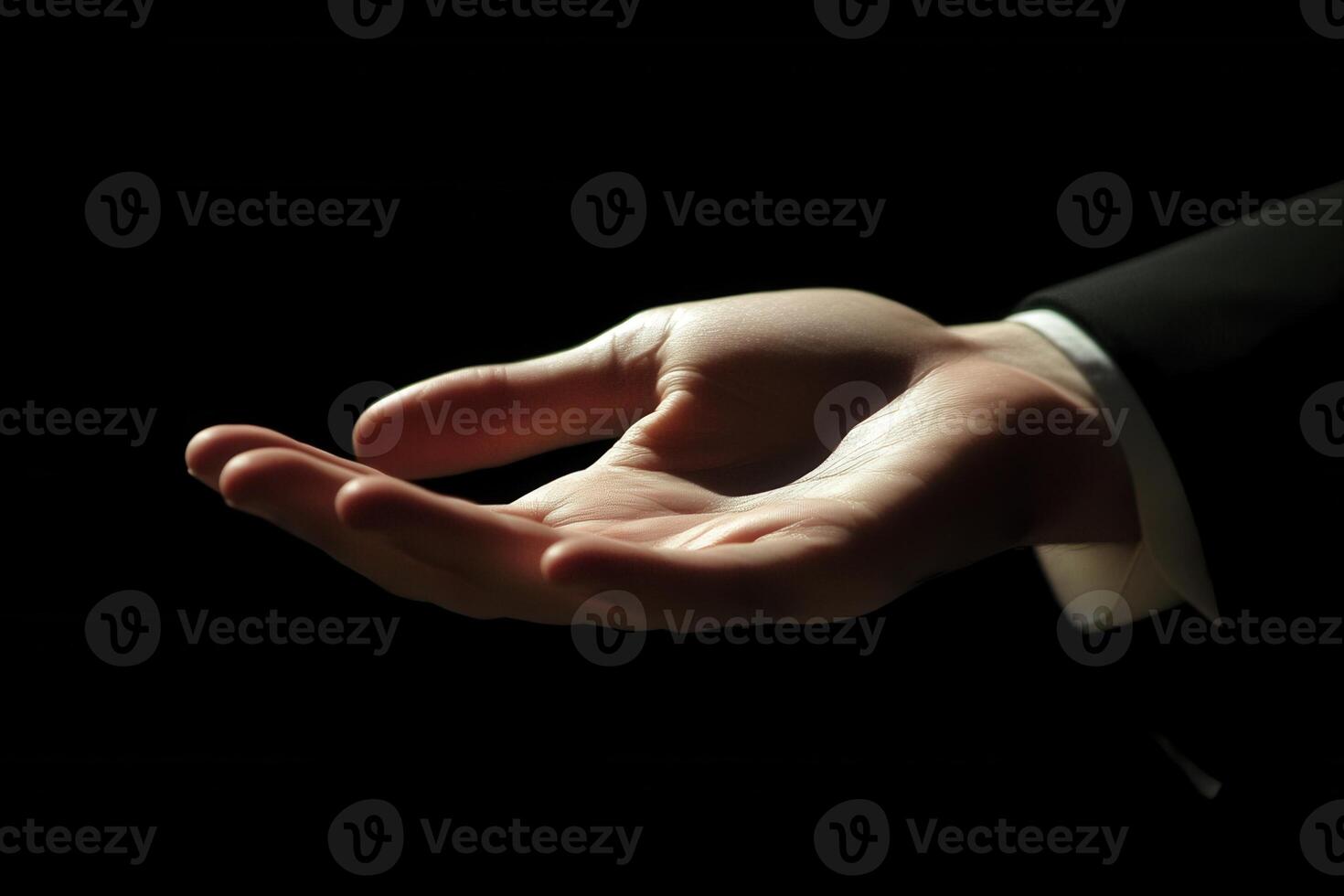 Elegant hand gesture in a dark setting, suggesting invitation or offering, with soft lighting photo