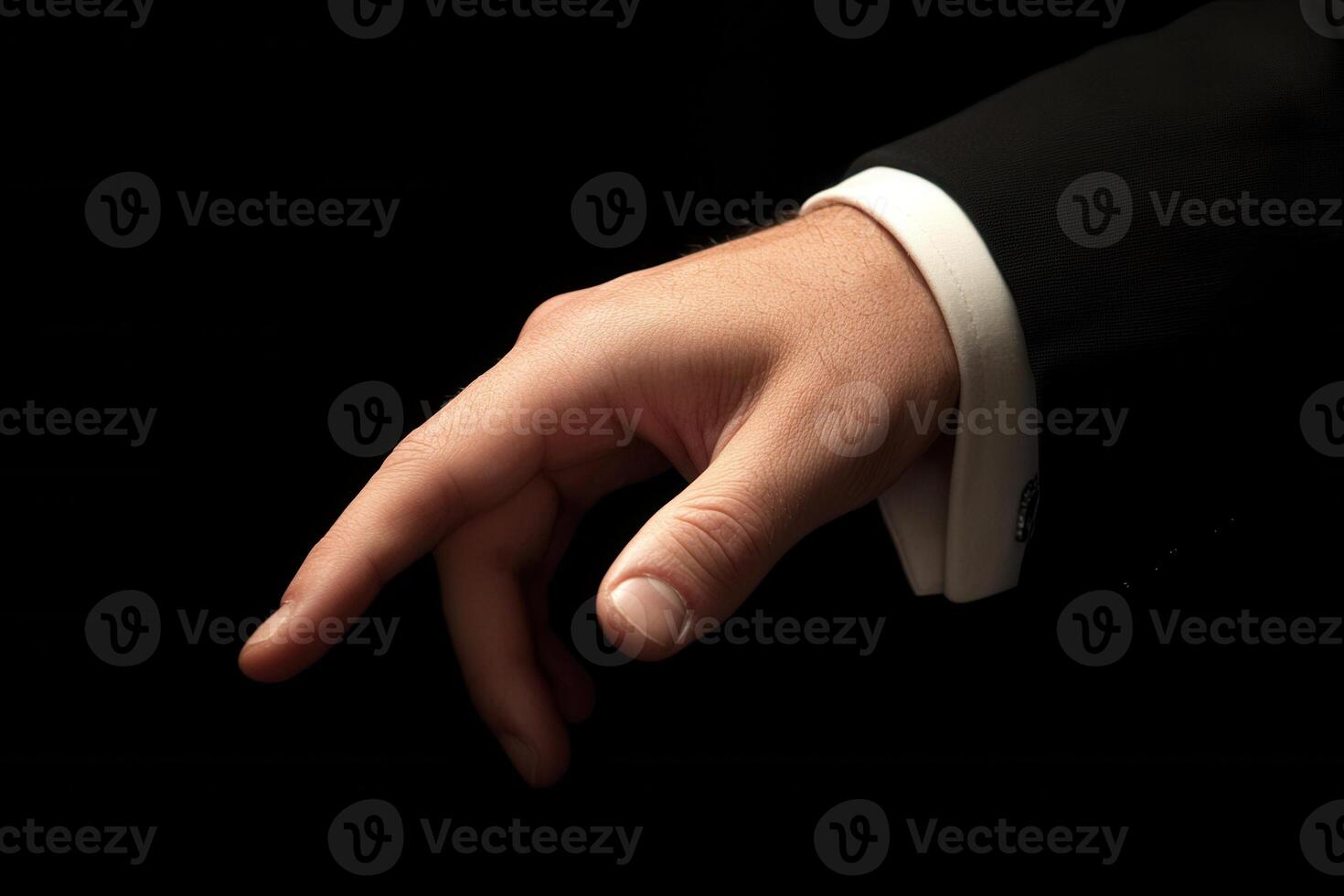 Elegant hand gesture in a formal suit, symbolizing sophistication and invitation photo