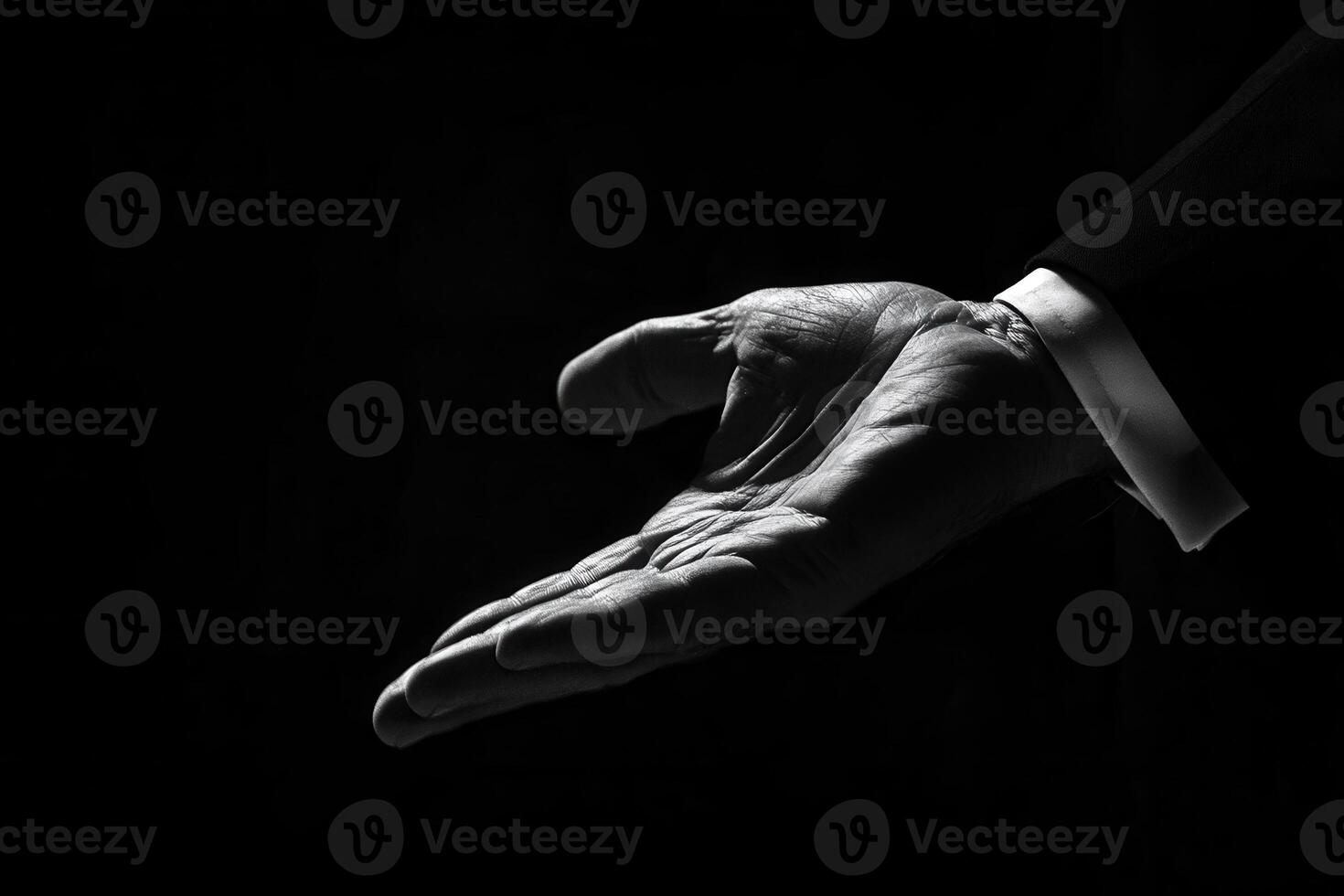 Elegant black and white image of a hand reaching out, symbolizing invitation or assistance photo