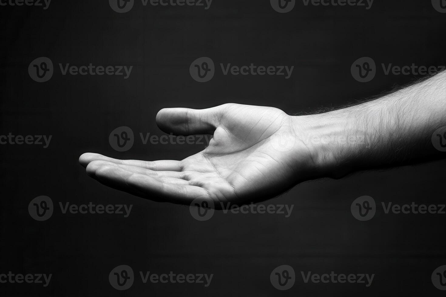 A close-up of an open hand against a dark background, symbolizing invitation or offering photo