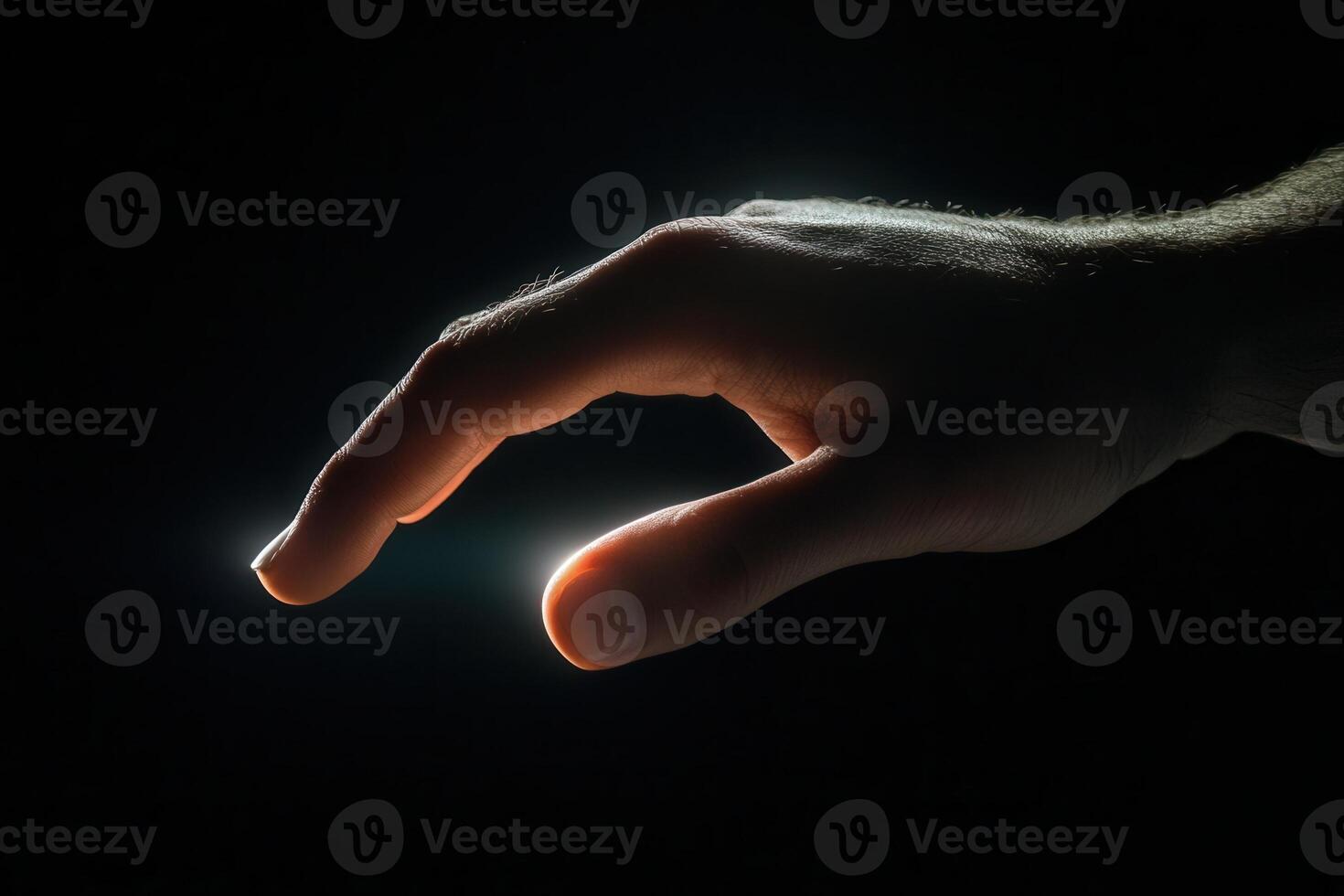 A human hand reaching out with soft lighting, symbolizing connection and hope in darkness photo