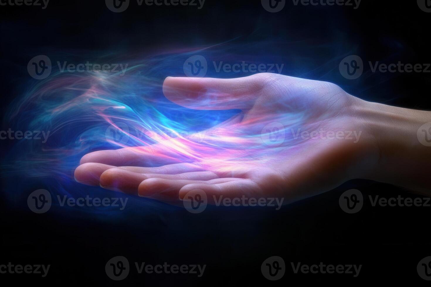 A human hand reaching out with colorful energy waves emanating from the palm in darkness photo