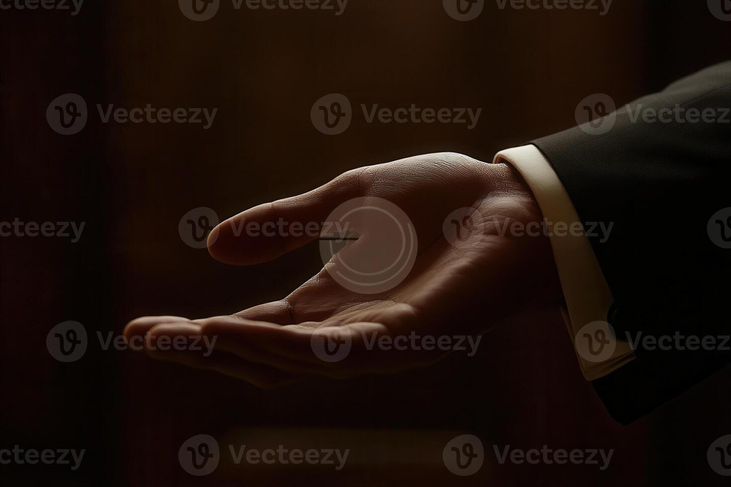 Elegant hand gesture with a coin, set against a blurred background, conveying anticipation photo