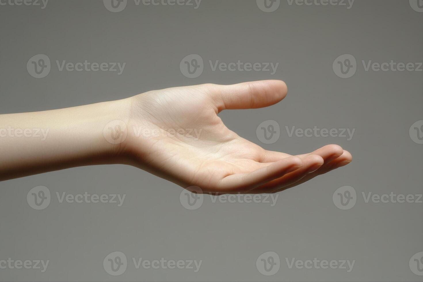A graceful open hand reaching out against a neutral background, symbolizing invitation and connection photo