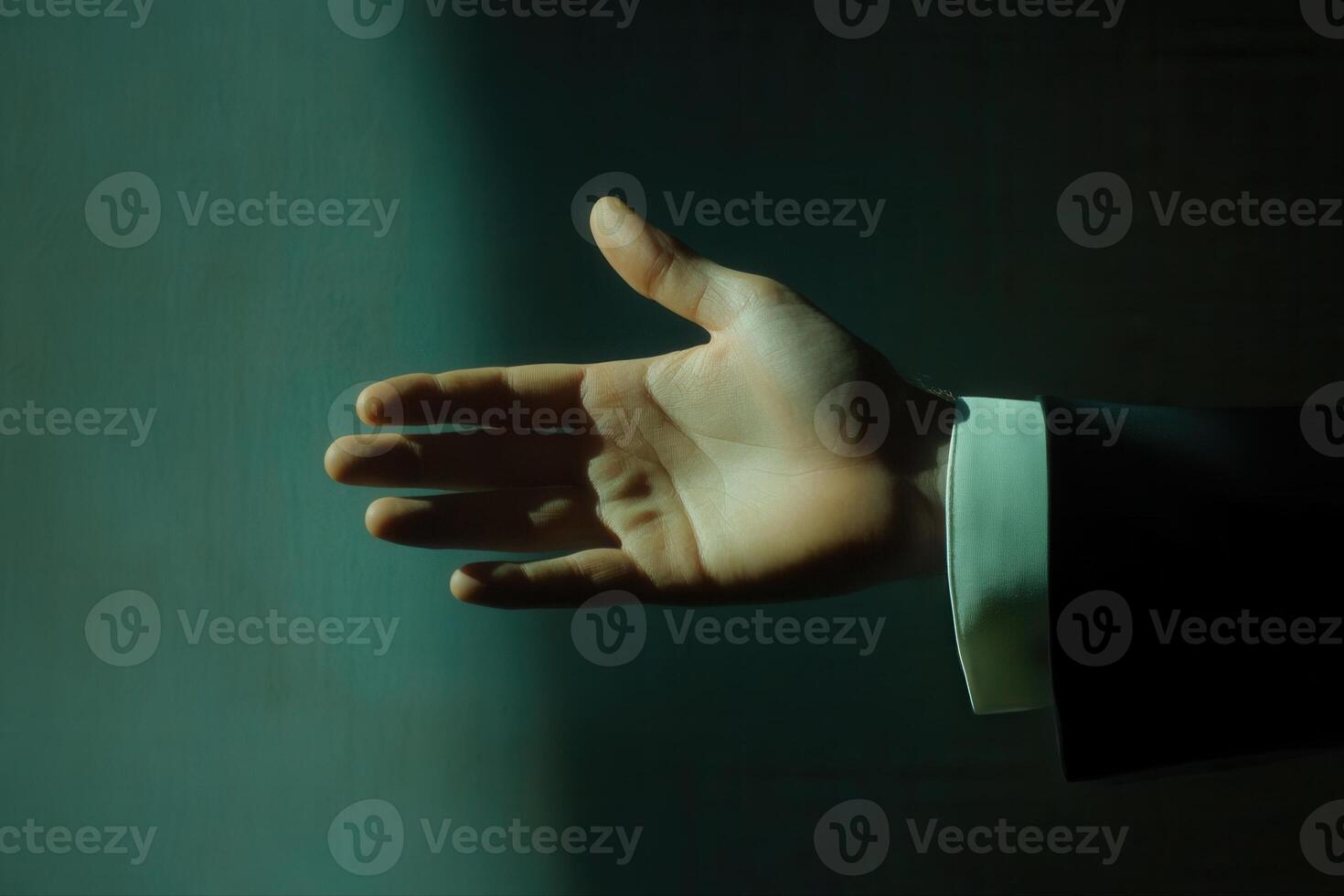 Elegant hand reaching out in soft light, suggesting invitation or connection in serene space photo