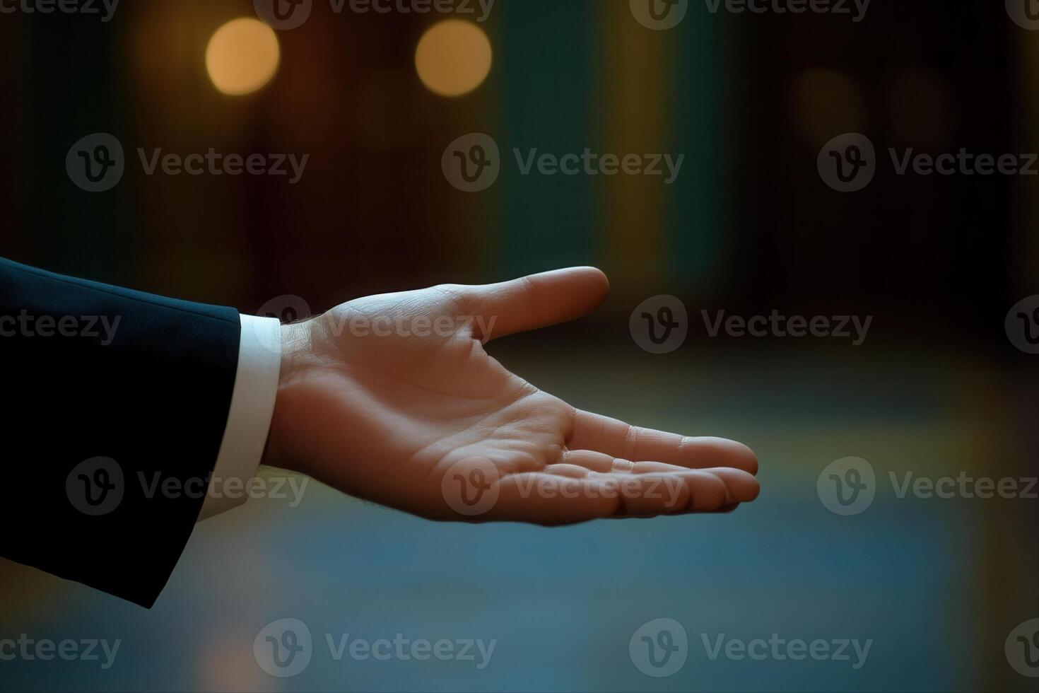 Elegant hand gesture in a formal setting, inviting interaction amidst a softly lit background photo