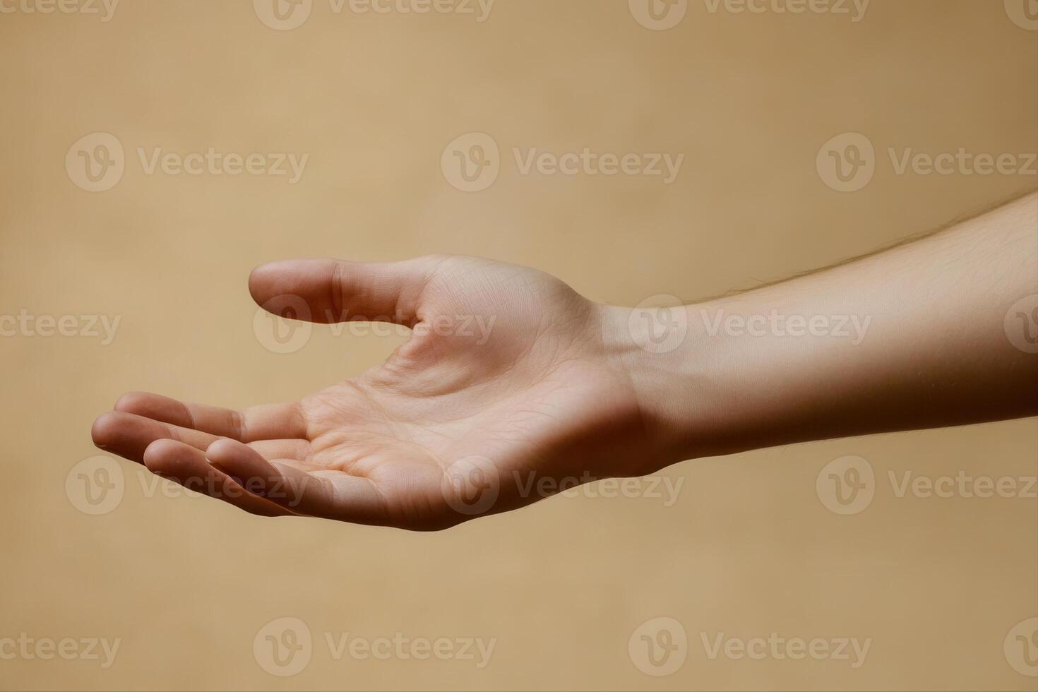 A close-up of an outstretched human hand against a soft, neutral background photo