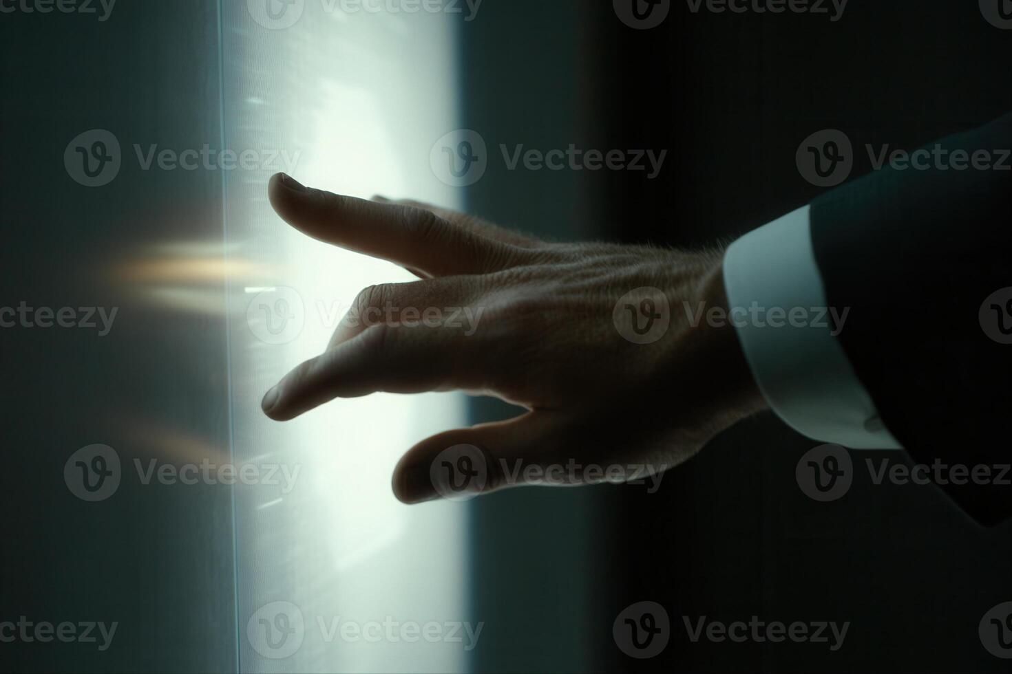 Elegant hand reaching towards a glowing interface in a modern, high-tech environment photo