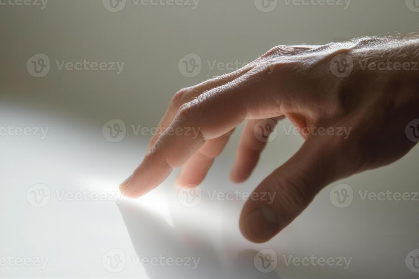 A close-up of a hand reaching towards a reflective surface, capturing a moment of curiosity photo