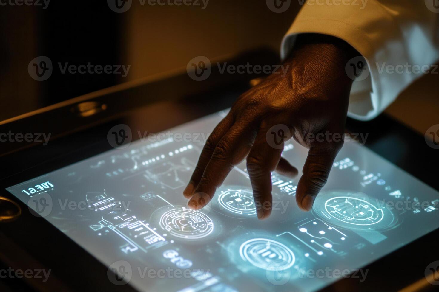 A close-up of a hand interacting with a futuristic touchscreen displaying data and graphics photo
