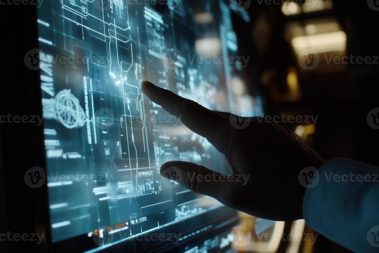 A hand interacting with a futuristic touchscreen display showcasing technical schematics photo