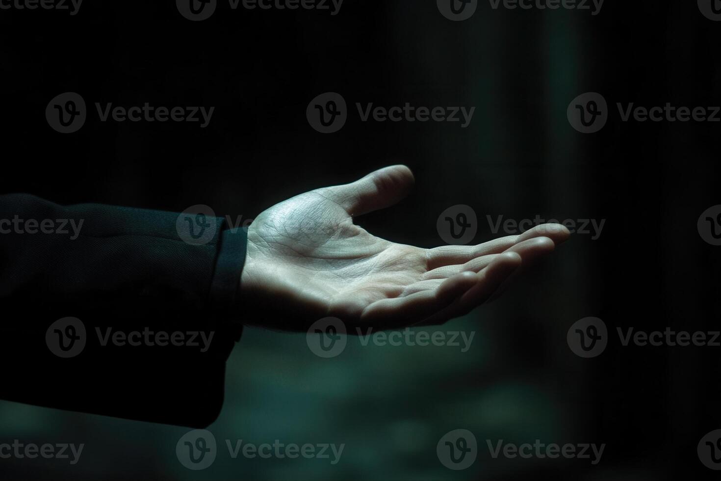 Outstretched hand in a dimly lit environment, symbolizing invitation and connection photo