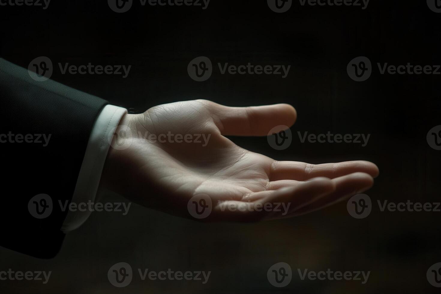 Elegant outstretched hand in a formal suit, symbolizing invitation and opportunity photo
