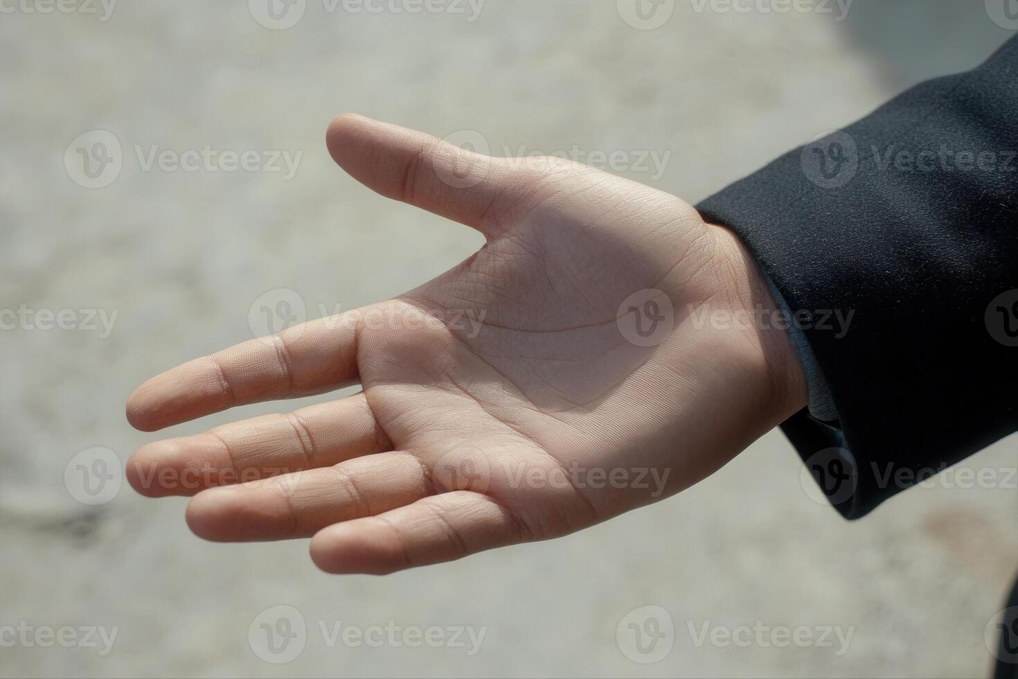 Open hand reaching out against a blurred background, symbolizing connection and opportunity photo