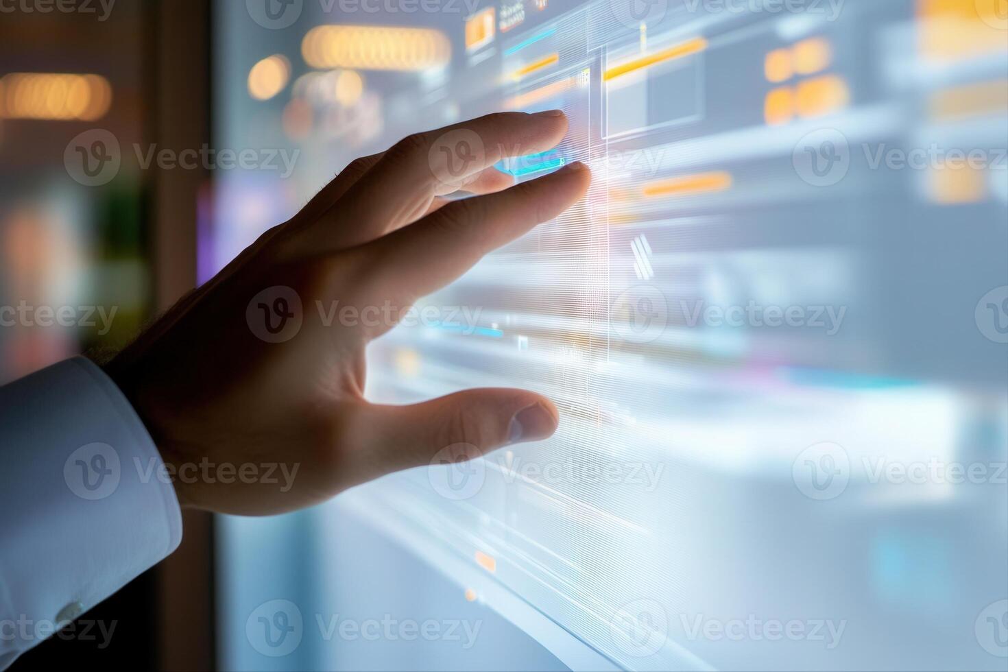 Futuristic hand interacting with a transparent touchscreen in a modern office environment photo