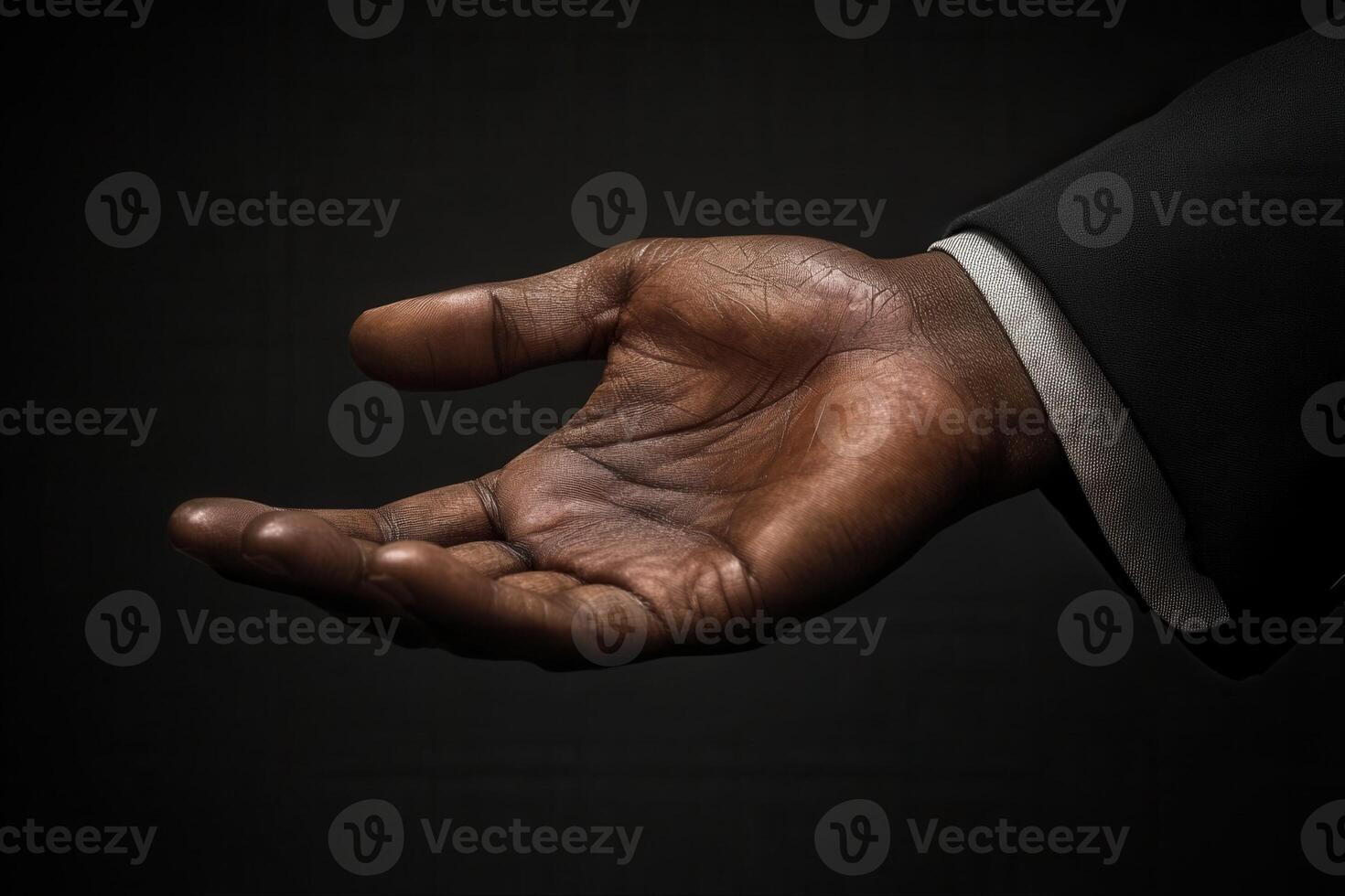 Outstretched hand in a dark setting, symbolizing openness and invitation for assistance photo
