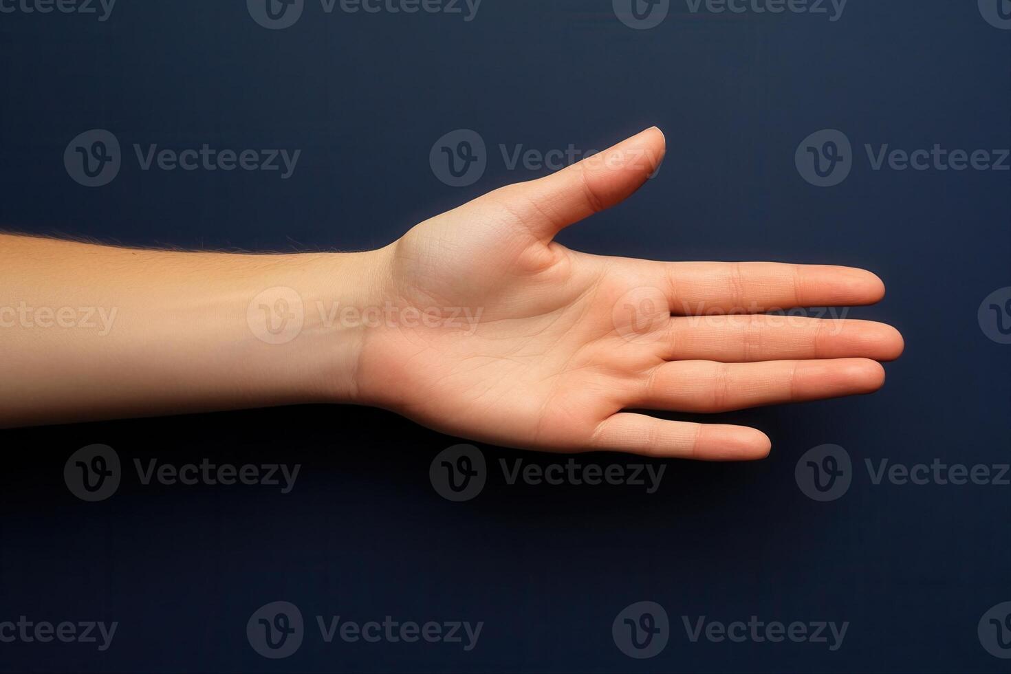 Open hand against a dark background, showcasing the palm and fingers for demonstration photo