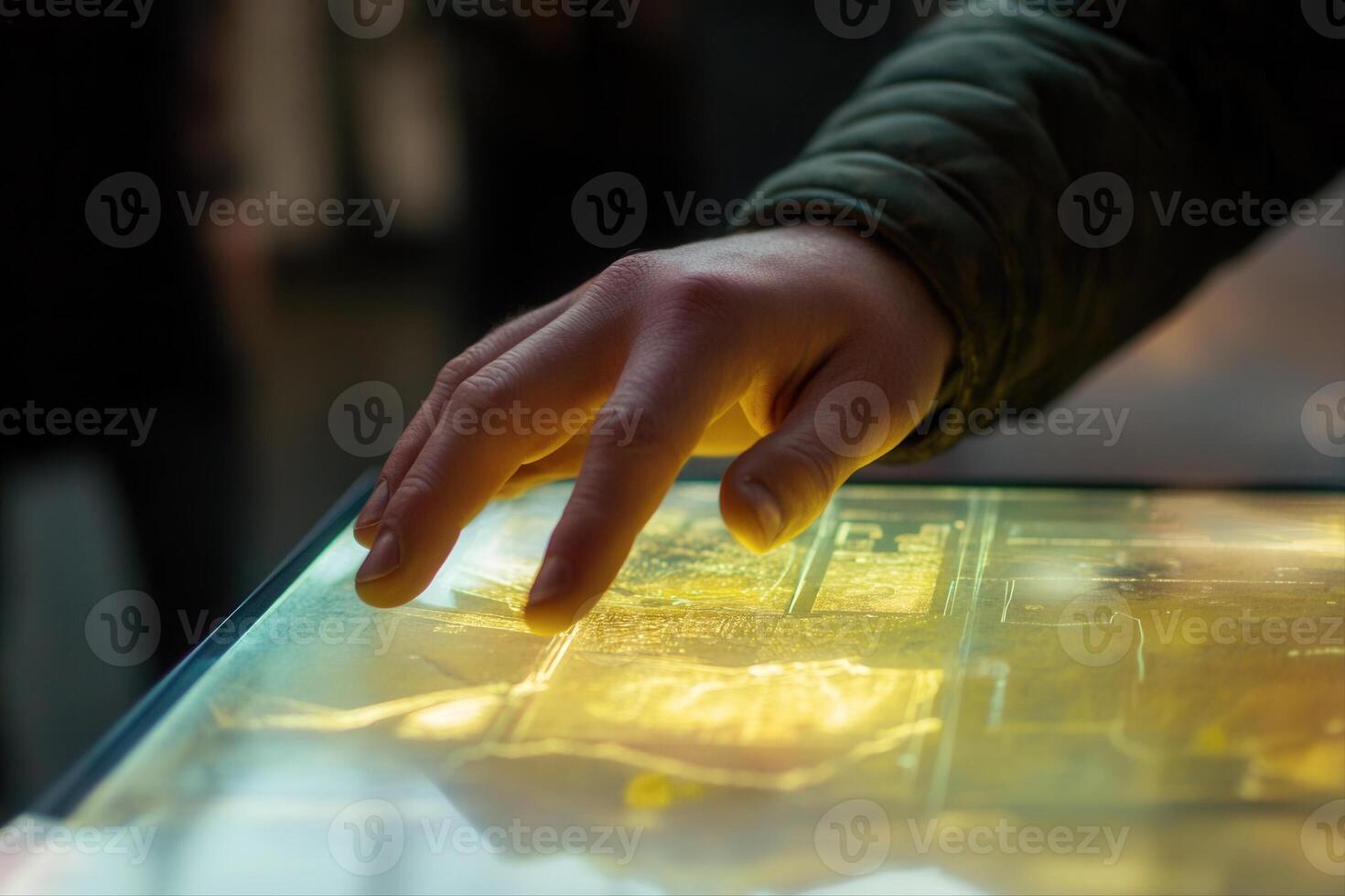 Person interacting with a glowing touchscreen display in a modern exhibition space photo