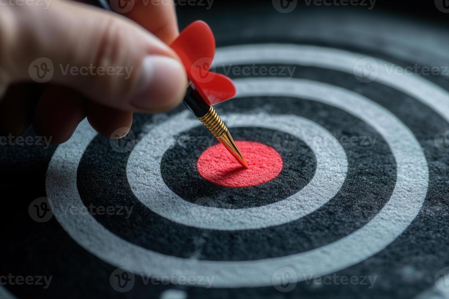 Hand placing a dart on a red bullseye target, emphasizing focus and precision in a game setting photo