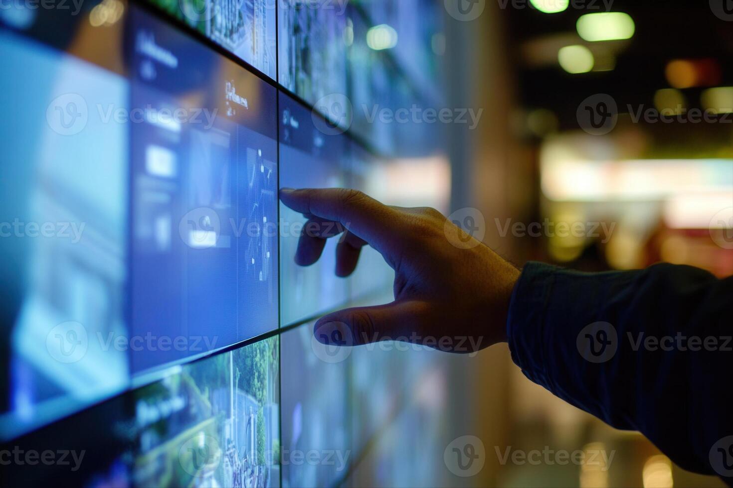 Person interacting with a digital display in a modern environment, showcasing technology use photo