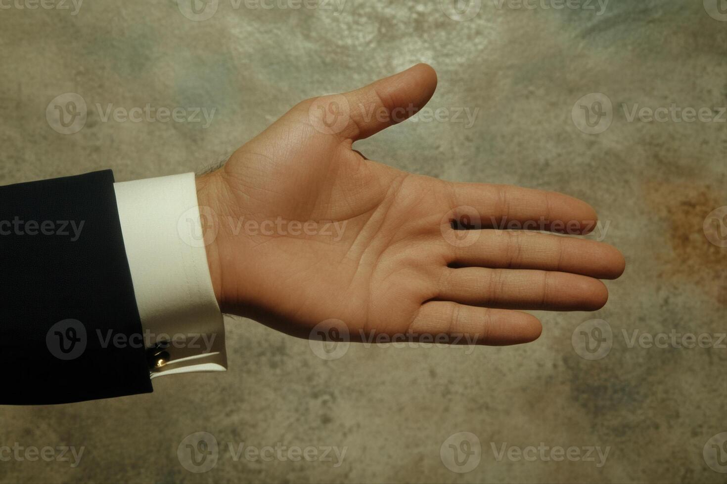 Open hand gesture against a textured background, symbolizing greeting or agreement photo