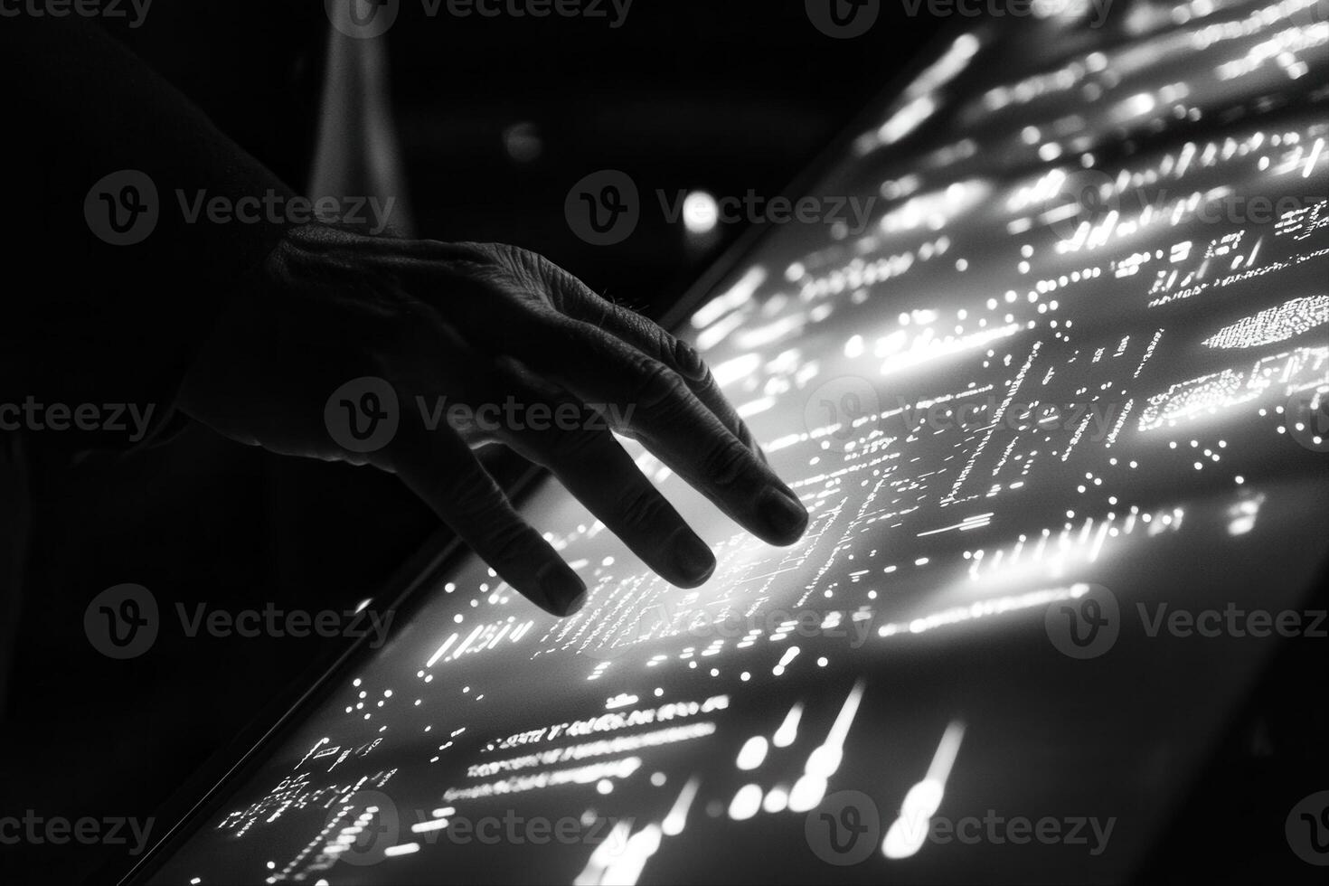Human hand interacting with a digital touchscreen displaying data visualizations at night photo