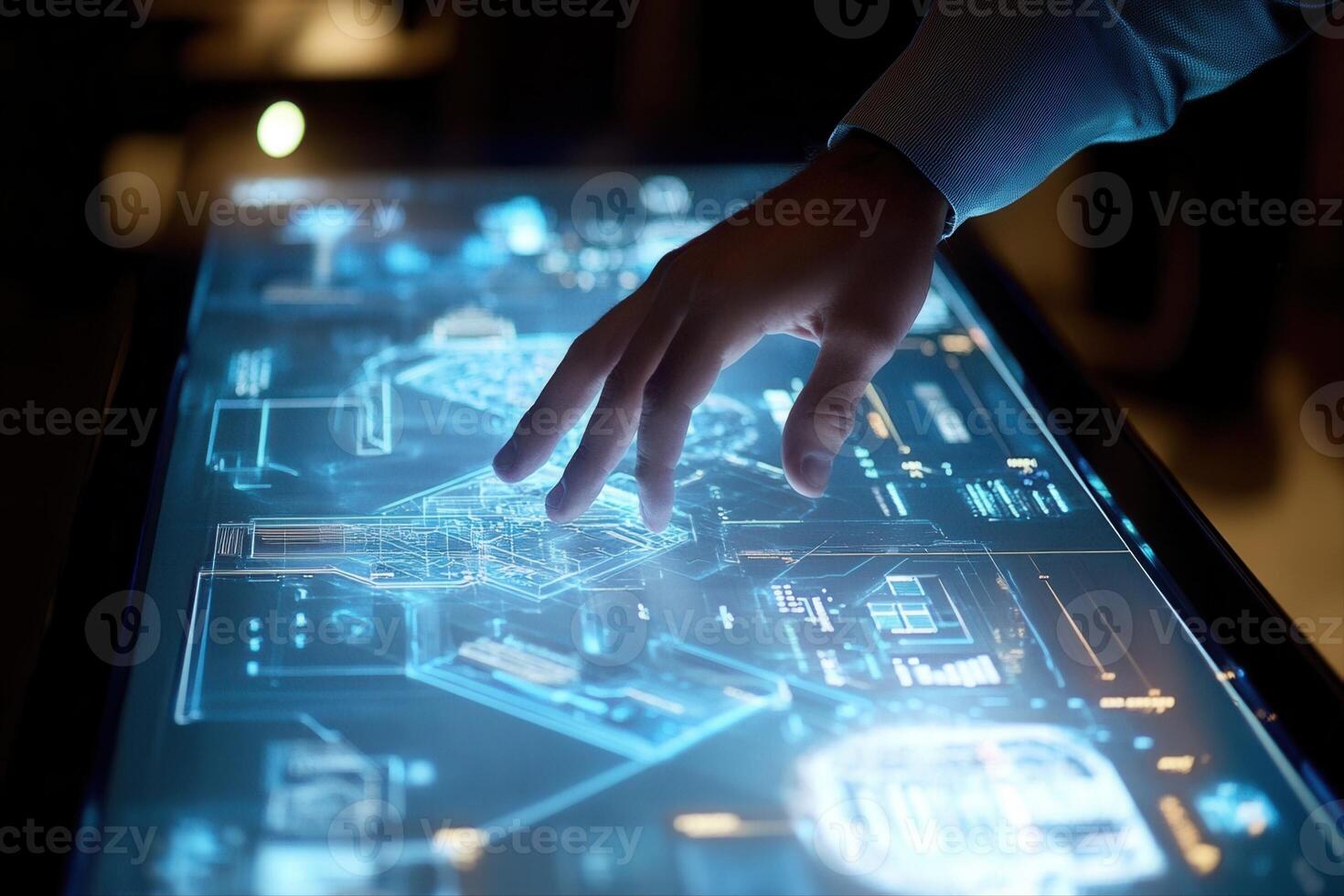 Person interacting with a futuristic touchscreen display showcasing digital designs and data photo