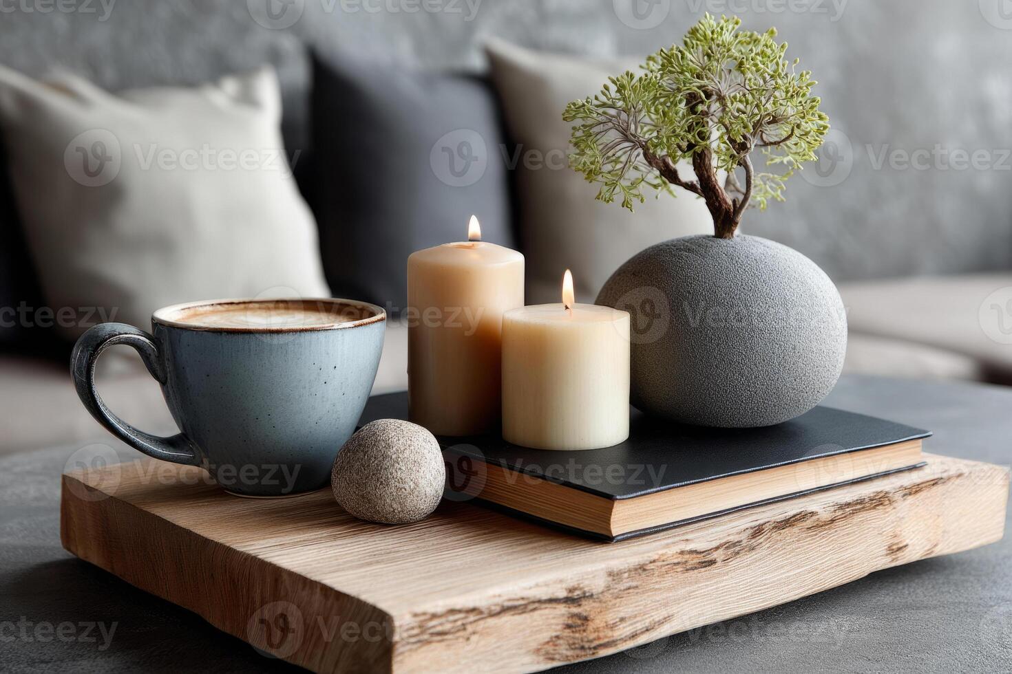 Coffee table with candles, books and potted plant photo