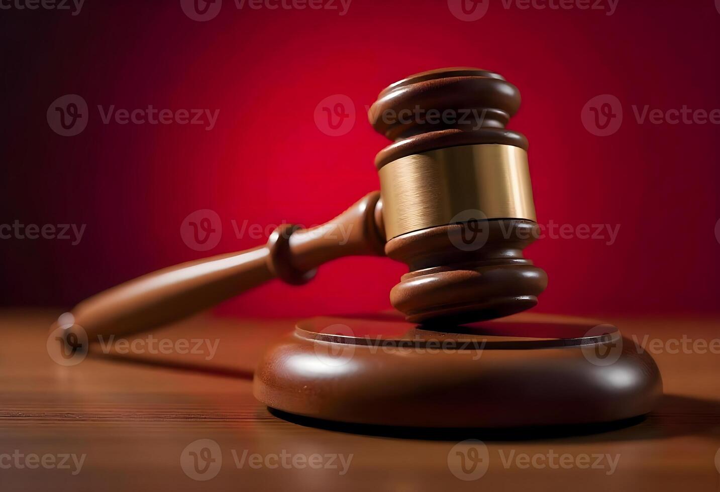 Judge Gavel on Wooden Block in Courtroom with Red Background photo
